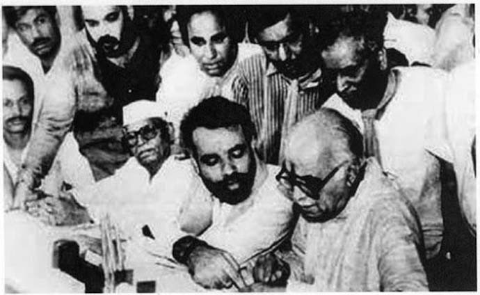 LK Advani filing his election nomination. Narendra Modi (L), then an RSS worker, assisting him. 